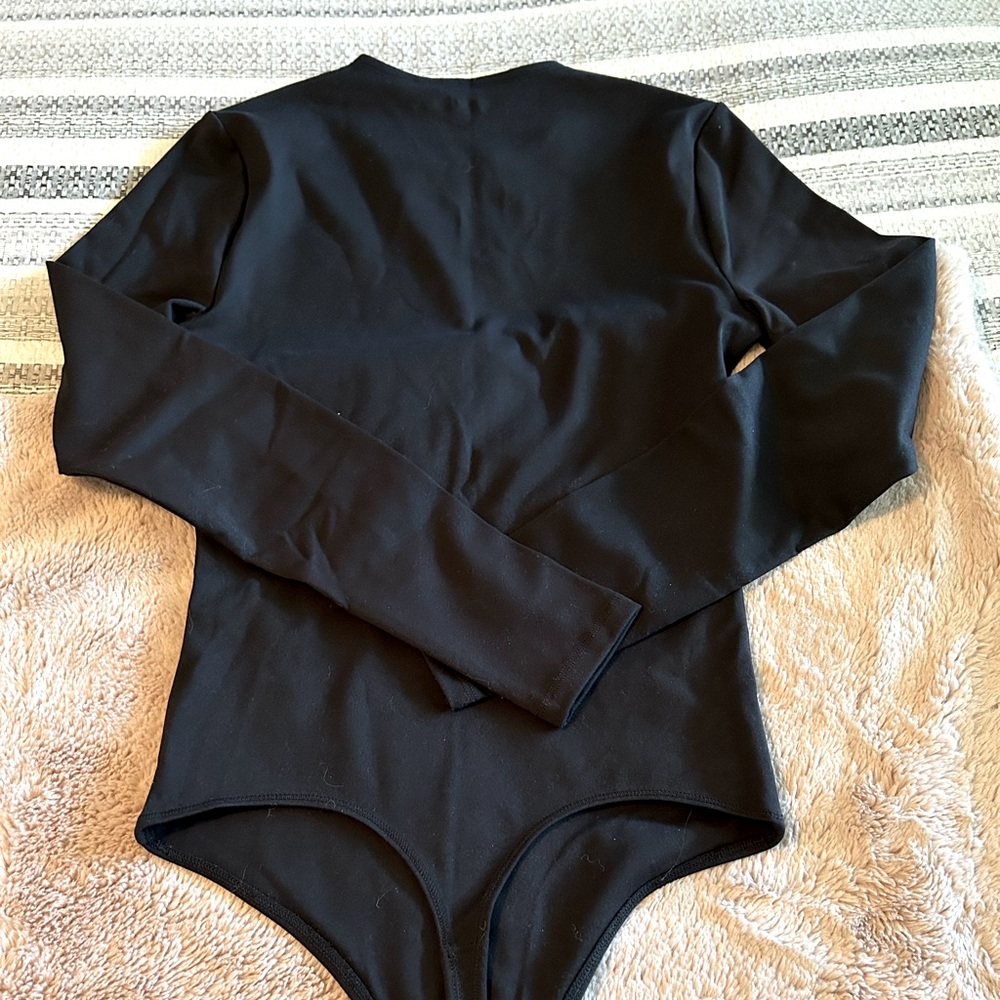 Abercrombie black bodysuit with snap closure. Great condition.